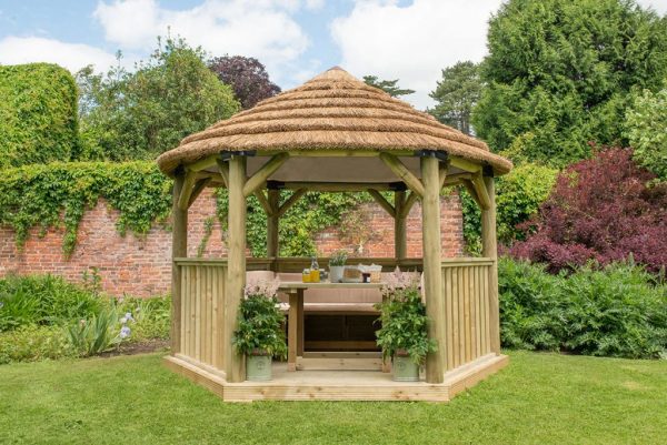 Forest Garden 3.6m Hexagonal Wooden Garden Gazebo with Thatched Roof - Furnished with Table, Benches and Cushions (Cream)