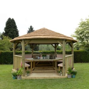 Forest Garden 4.7m Hexagonal Wooden Garden Gazebo with Thatched Roof - Furnished with Table, Benches and Cushions (Cream)