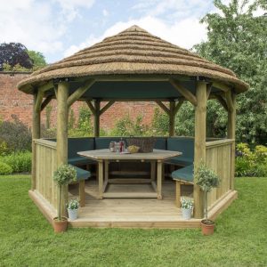 Forest Garden 4m Hexagonal Wooden Garden Gazebo with Thatched Roof - Furnished with Table, Benches and Cushions (Green)