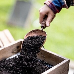 Copper hand compost scoop